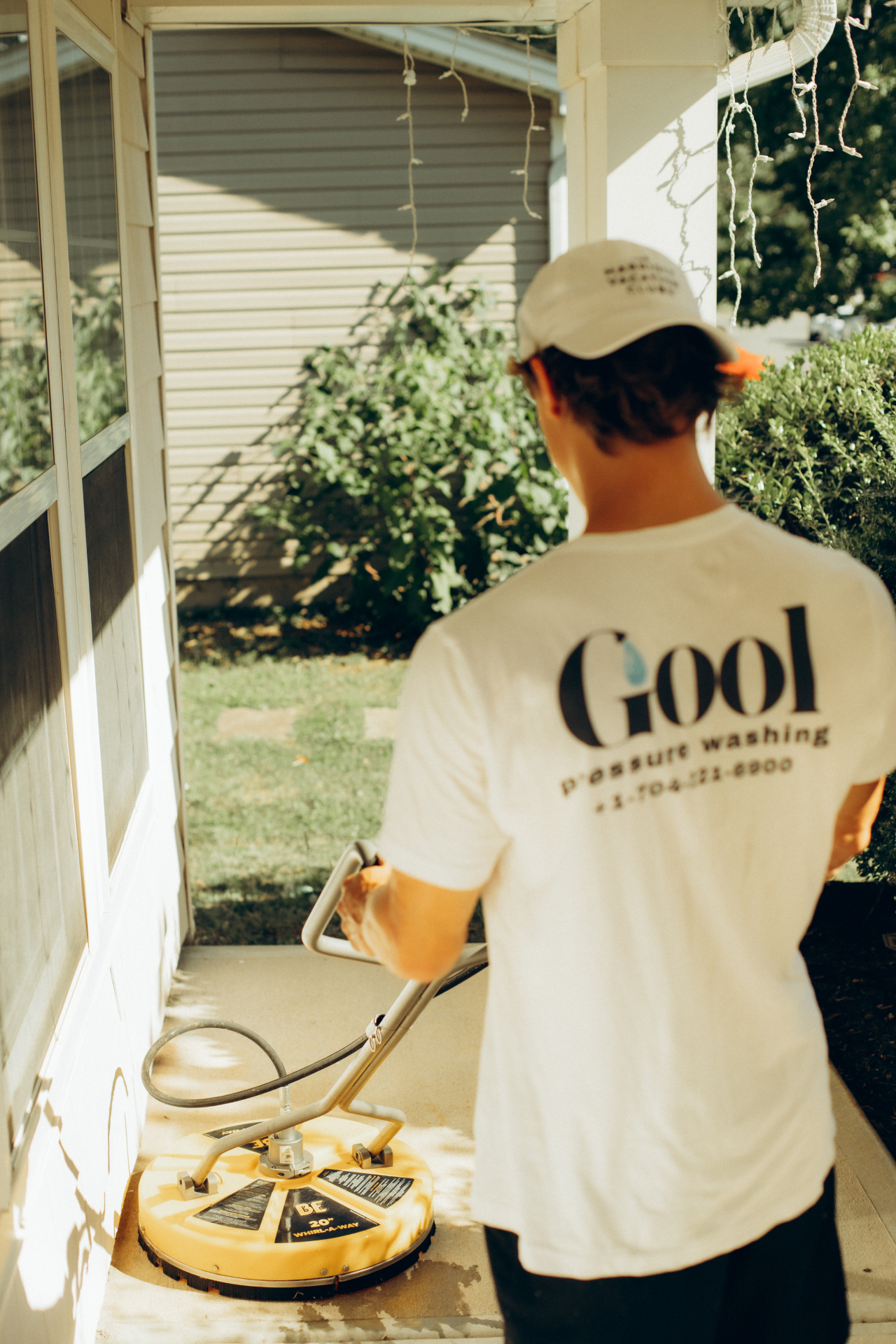 GOOL technician surface cleaning a Charlotte porch