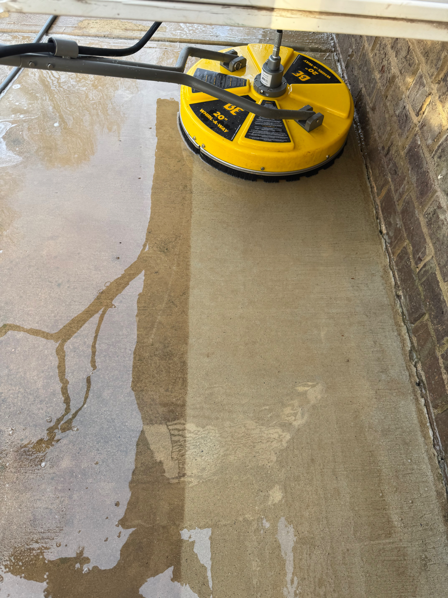 Driveway surface cleaner mid-job